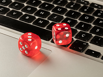 games dice sitting on laptop