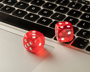 games dice sitting on laptop