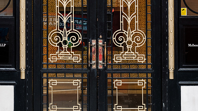 a double doors with ornate designs
