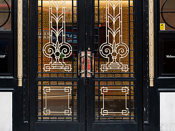 a double doors with ornate designs