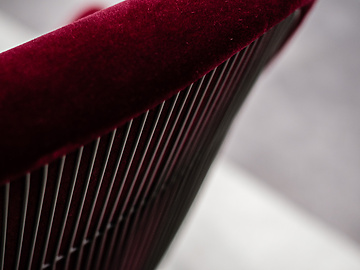 Back of red velvet chair