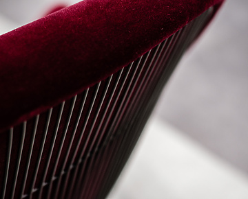 Back of red velvet chair