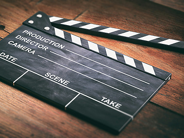 movie-clapper-on-wooden-background-3d-illustration-
