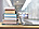 Books stacked next to laptop on desk