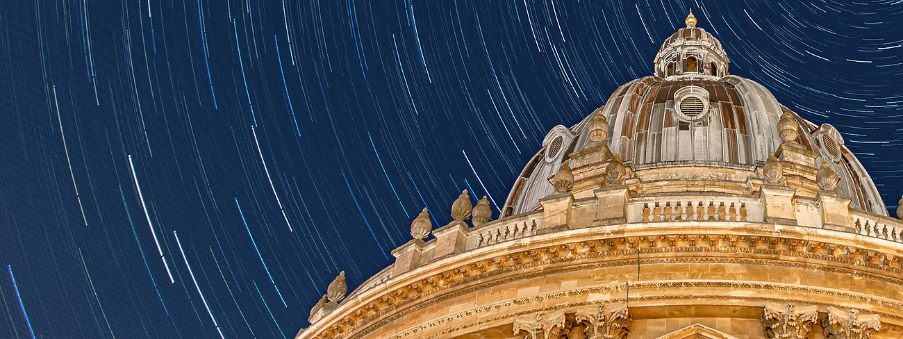 a circular building with stars in the sky