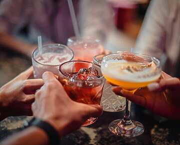 a group of people holding drinks