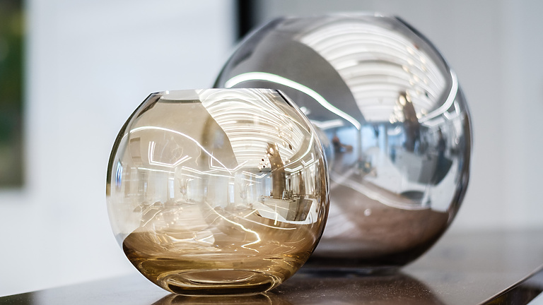 Two glass vases on a table