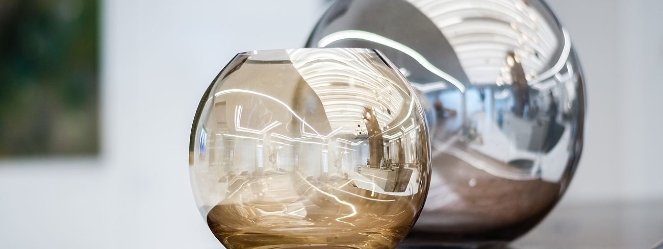 Two glass vases on a table