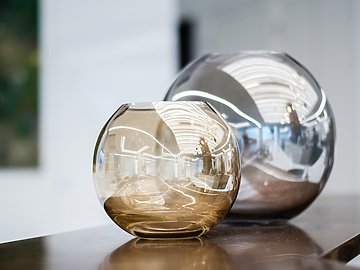 Two glass vases on a table