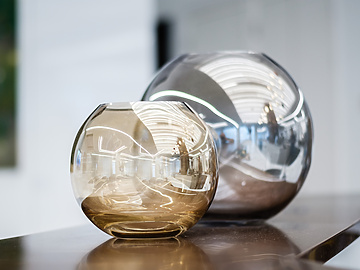 Two glass vases on a table