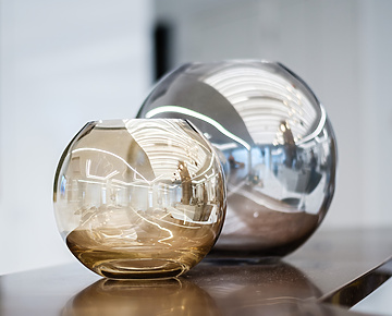 Two glass vases on a table