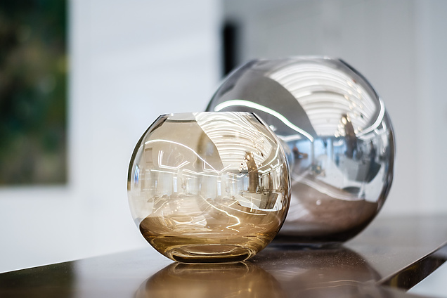 Two glass vases on a table