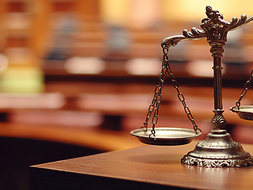 a scale of justice on a table