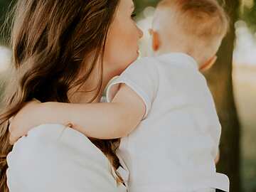 a person holding a baby