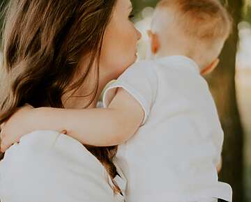 a person holding a baby