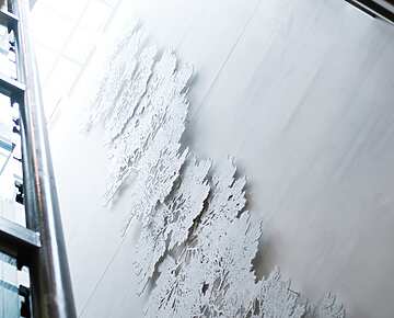 a white wall with trees on it