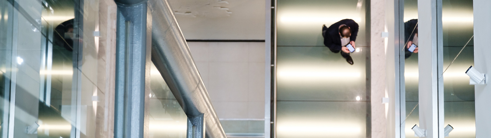 a person sitting walking through a corporate building