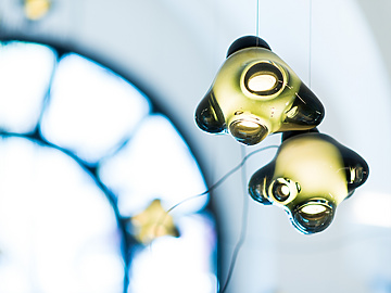 a group of lights from a ceiling