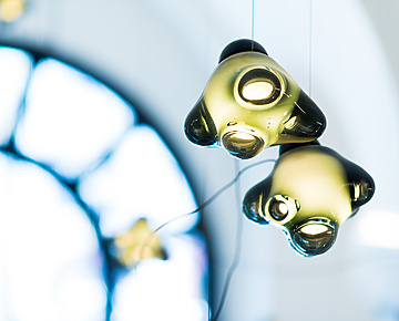 a group of lights from a ceiling