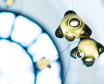 a group of lights from a ceiling