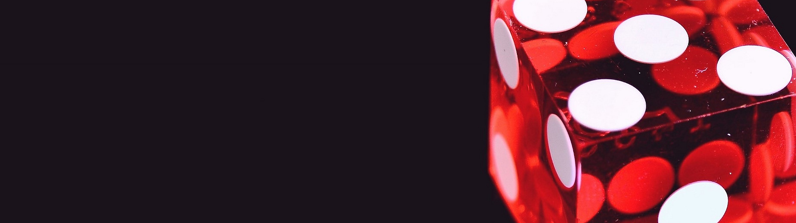 a red dice with white dots