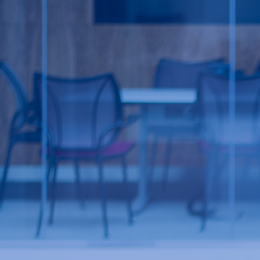 Office room behind blue glass