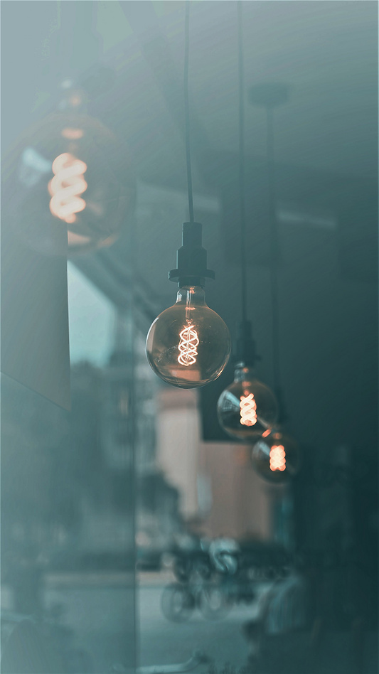 a group of light bulbs hanging from a ceiling
