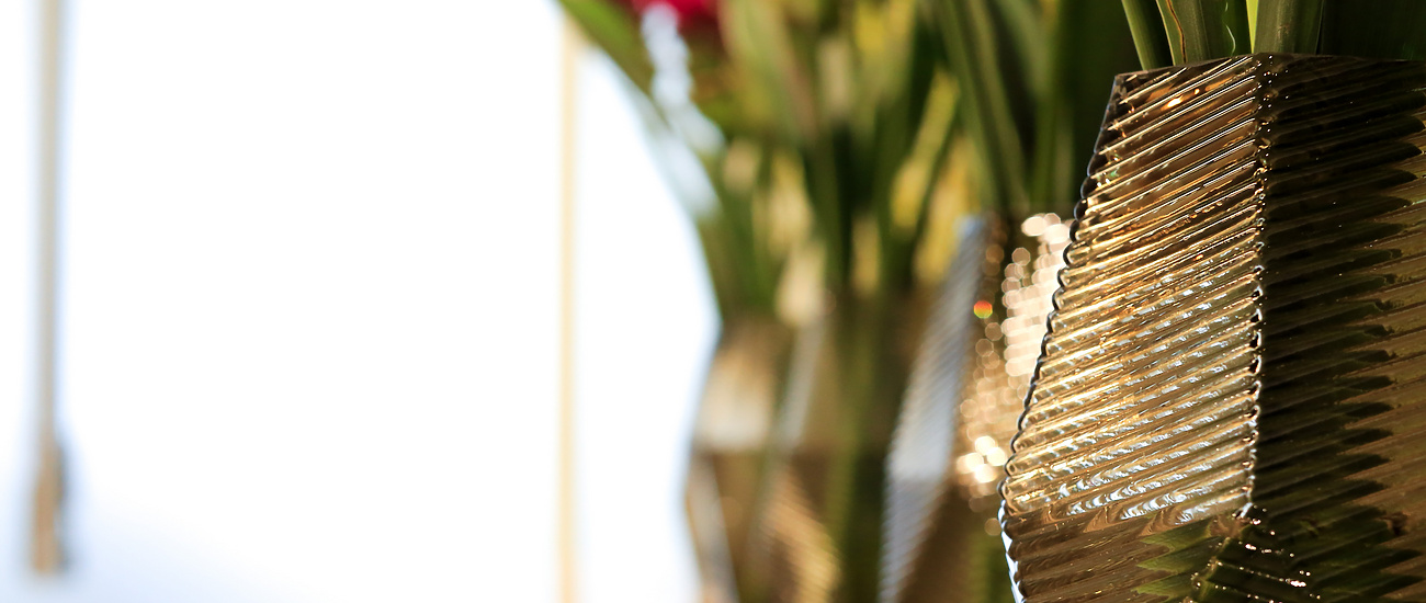 a group of vases with flowers