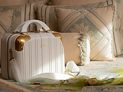 A luxury handbag on a bed