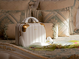 A luxury handbag on a bed