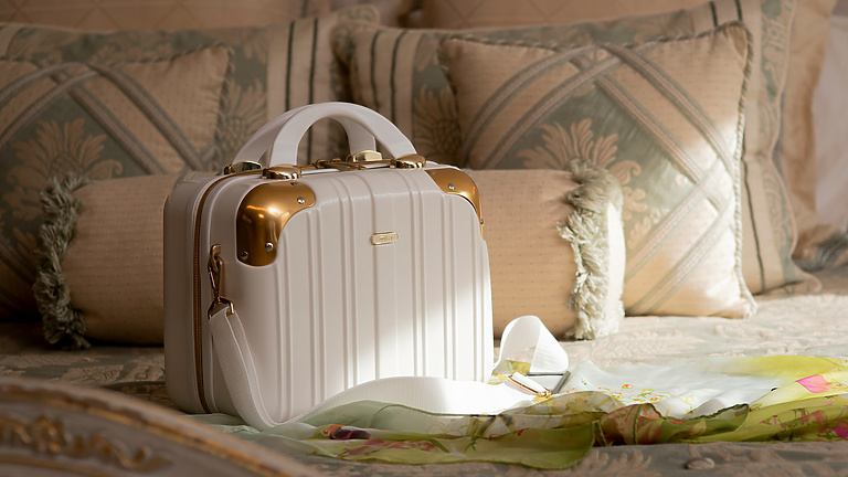 A luxury handbag on a bed