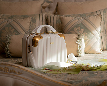 A luxury handbag on a bed