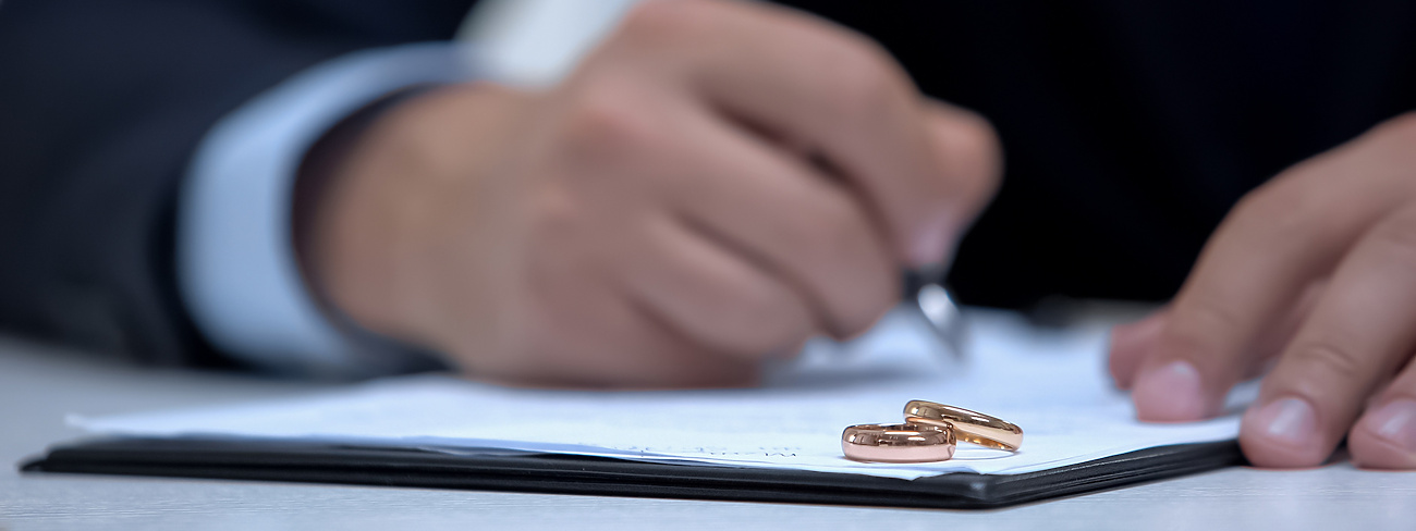Person signing divorce papers