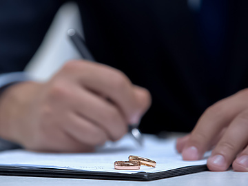 Person signing divorce papers