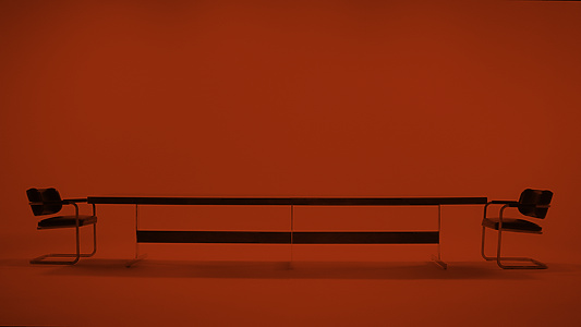 Empty long table with chairs