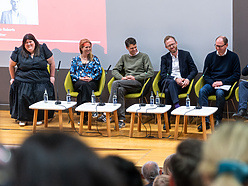 a group of people sitting in chairs