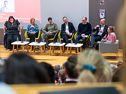 a group of people sitting in chairs