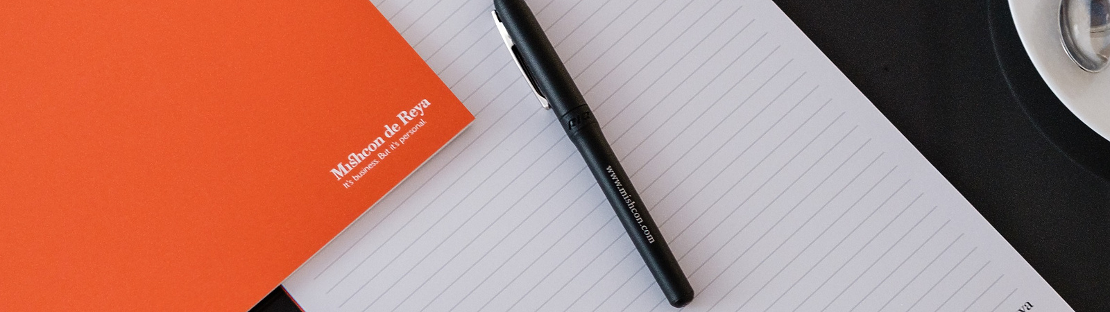 Mishcon de Reya pen and paper on table