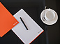 Mishcon de Reya pen and paper on table
