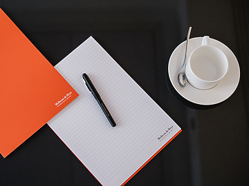 Mishcon de Reya pen and paper on table