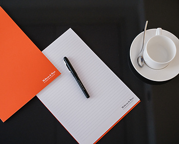 Mishcon de Reya pen and paper on table