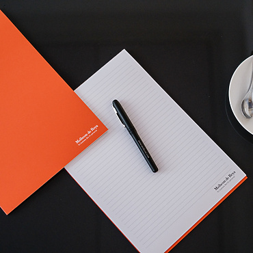 Mishcon de Reya pen and paper on table