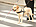 Guide dog helping blind man on pedestrian crossing