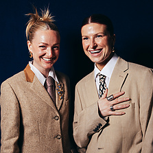 a couple of women in suits