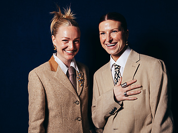a couple of women in suits