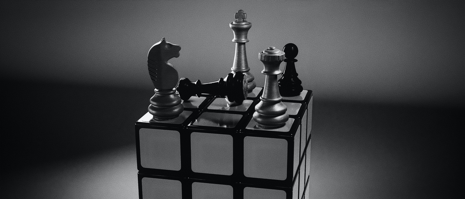 a rubics cube with chess pieces on top