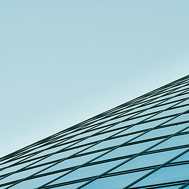 a glass building with blue sky