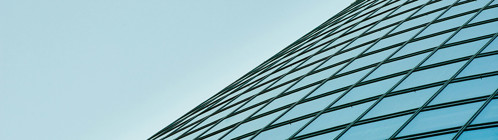 a glass building with blue sky