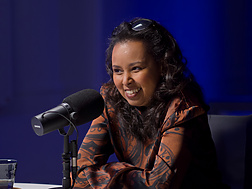 a person sitting at a microphone