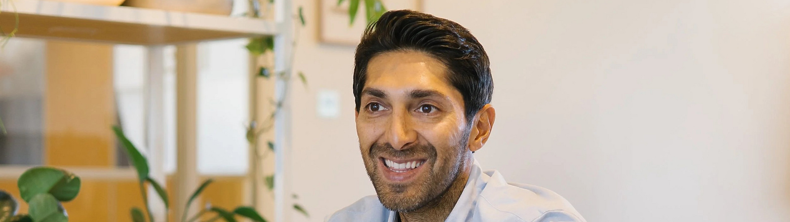 Faisal sitting on a couch